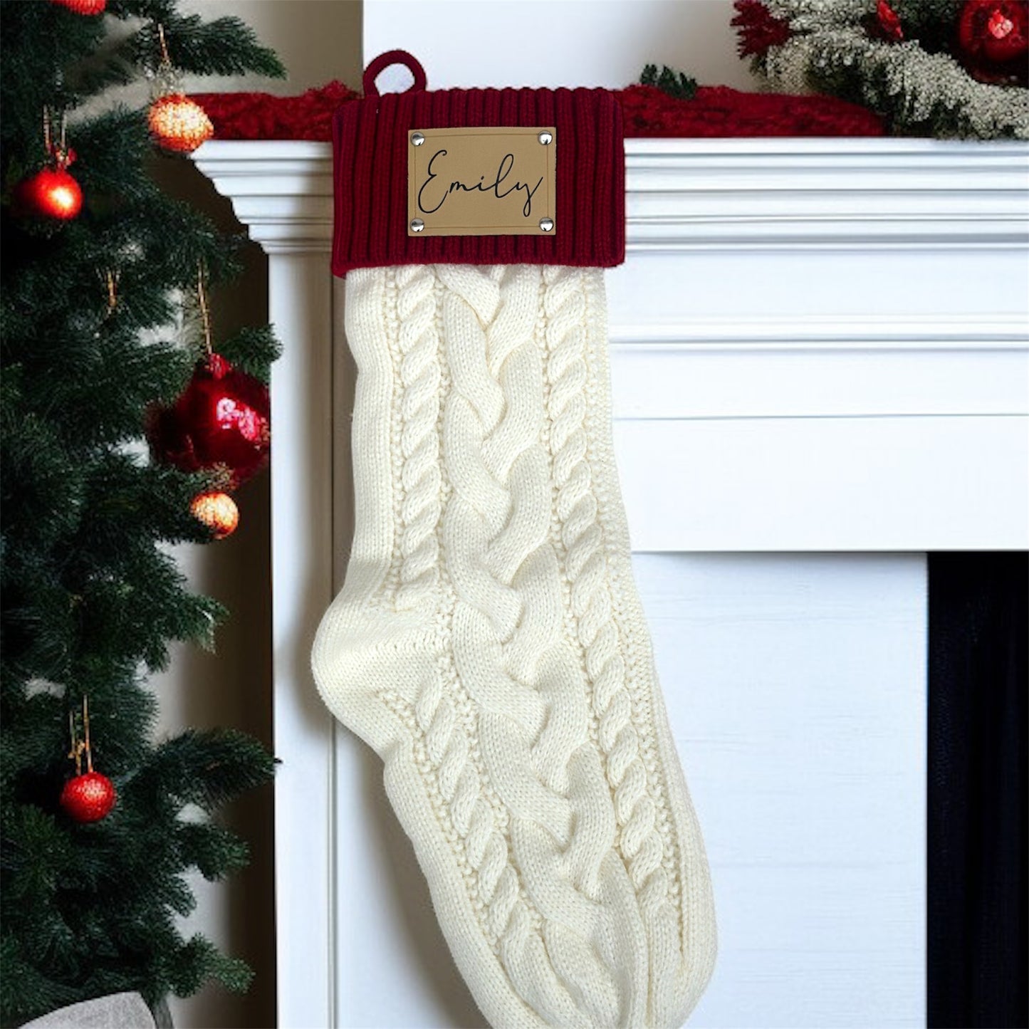 White knitted Christmas stocking with red trim hanging on a fireplace mantle.